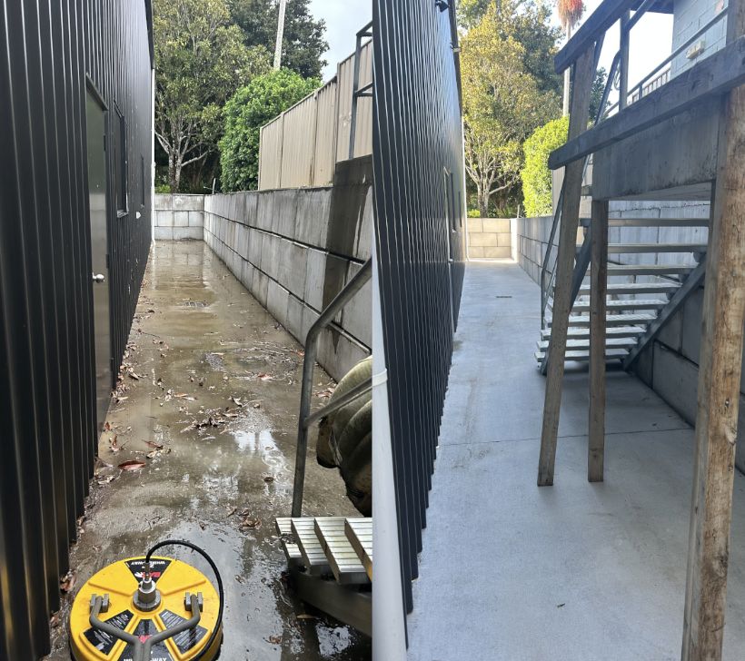 Before and after pressure cleaning a concrete walkway